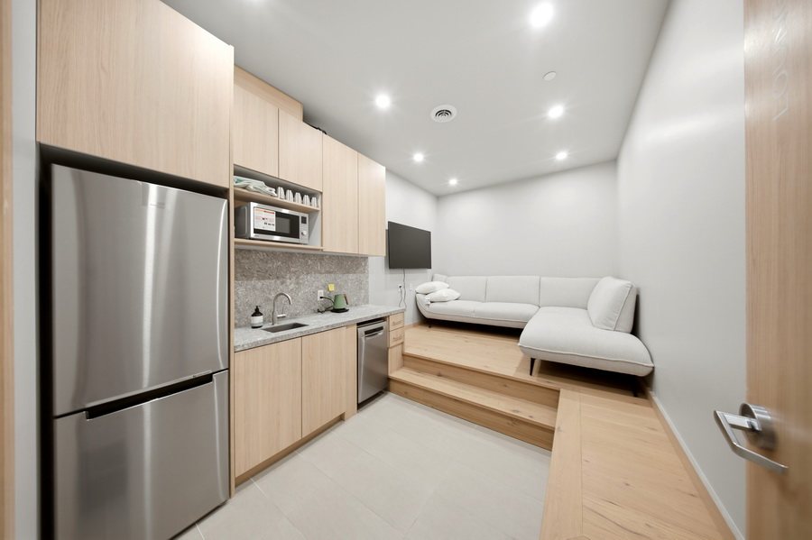 Staff lounge with kitchenette and built-in seating